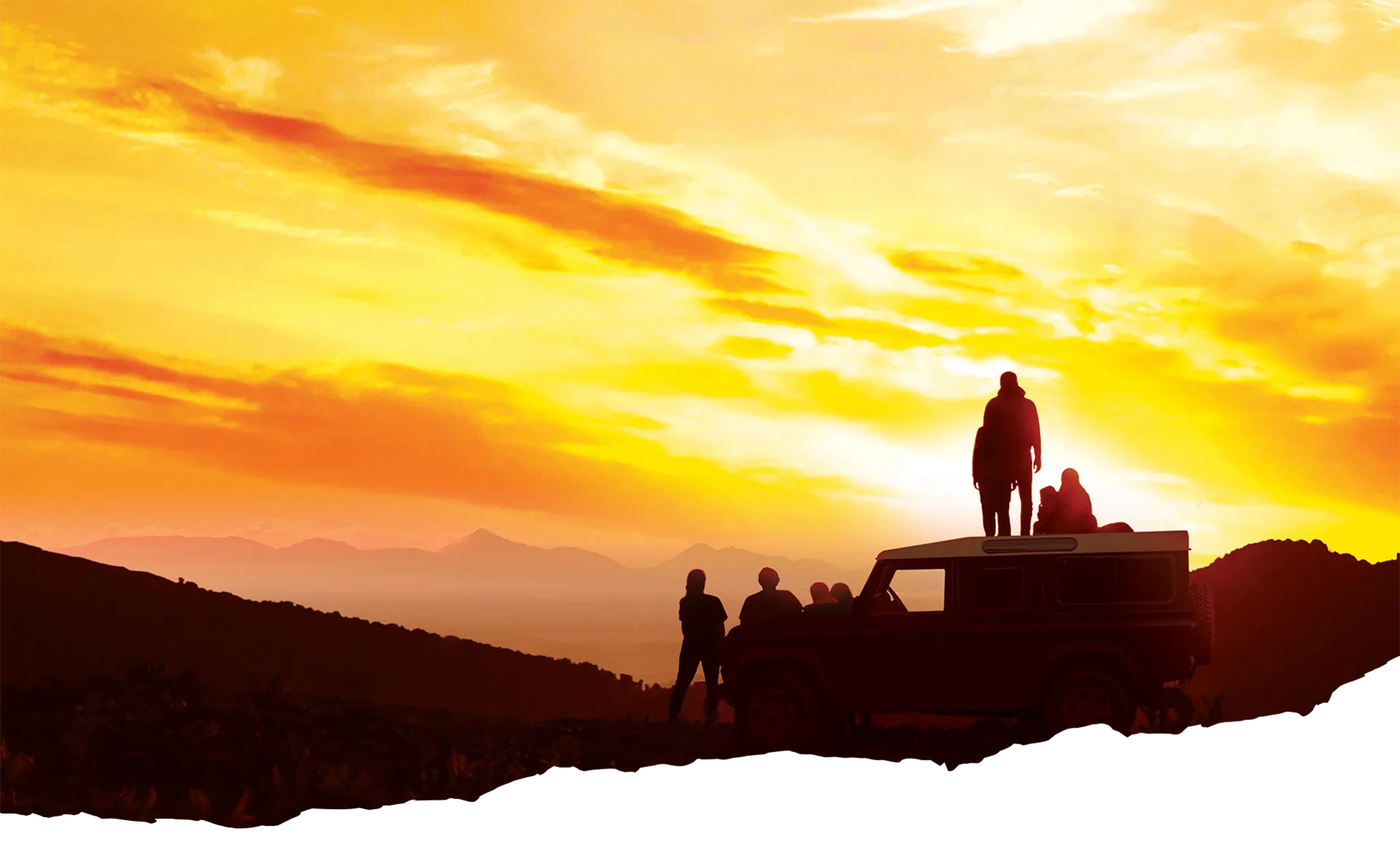 Adventurers on a jeep watching a Sri Lankan sunset